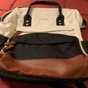 A Lovevook Laptop backpack with carving port, side pockets